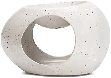 Artistic oil diffuser for aromatic home ambiance.