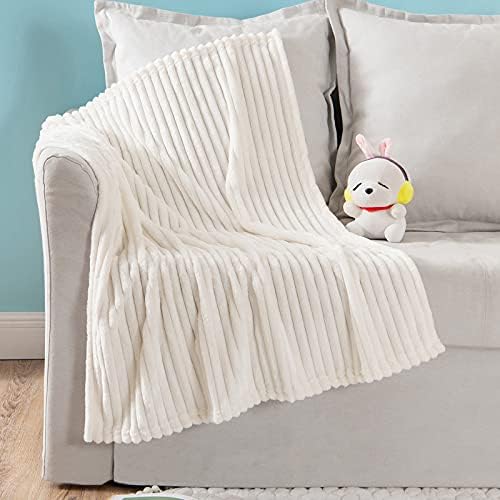 Cream baby blanket for warmth and comfort.