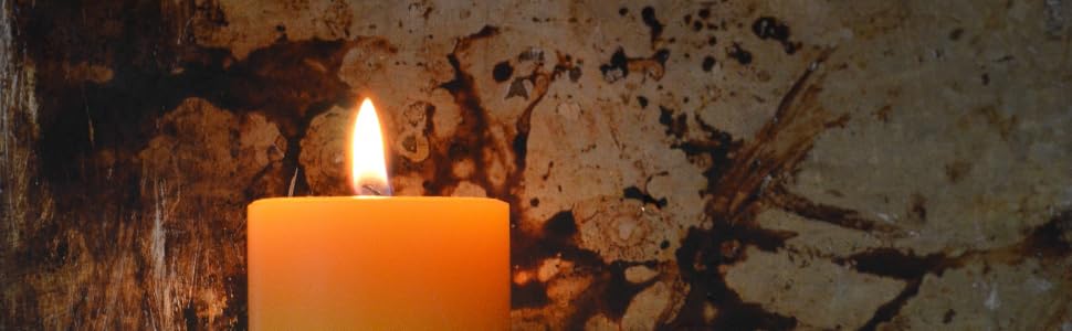 Raw Bluecorn Beeswax pillar candle glowing golden
