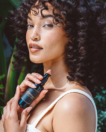 beautiful model with pure skin alitura gold serum clean ingredients anti aging