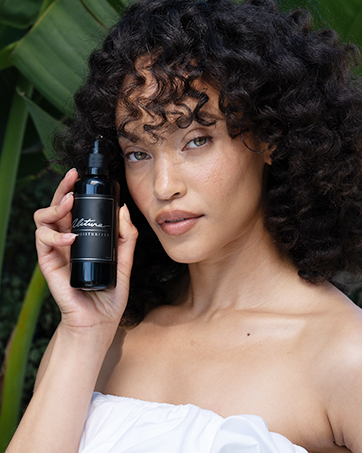 woman holding alitura moisturizer anti aging organic pure ingredients