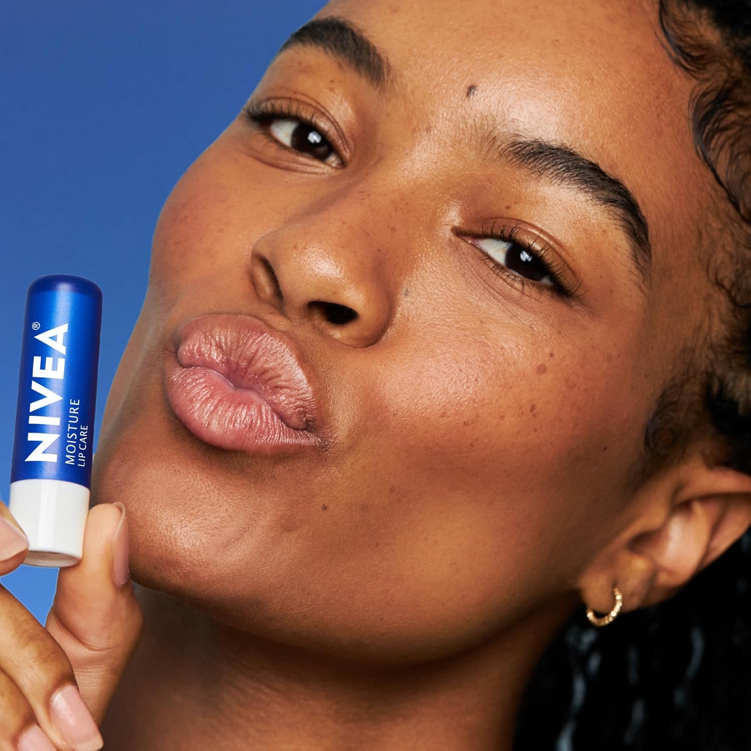 NIVEA Moisture Lip Care, Hydrating Lip Balm with Shea Butter, Nourishing Oils and Vitamin C & E, 3-in-1 Moisture, Repair and Nourish, 0.17 Oz Stick, Pack of 4 - Image 8