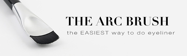 image of curved makeup brush on light grey background