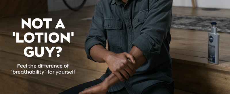 Man wiping lotion into his arm. Text: Not a lotion guy? feel the difference with breathability