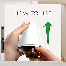 2. Remove refill cap. Firmly push the refill bottle upright until you hear it click in