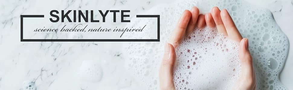 Skinlyte logo kojic acid soap bubbles in hand