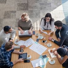 Group of coworkers around a table