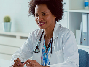 Dermatologist sitting at a desk