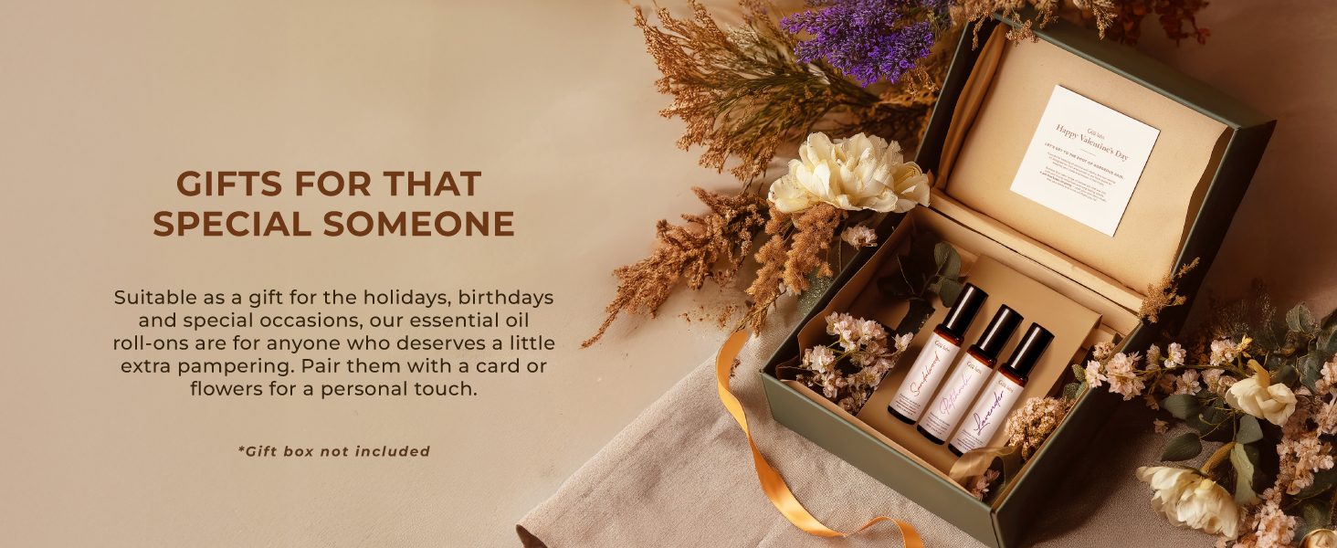Gift box containing perfume bottles and a card, surrounded by dried flowers. Text above suggests it's for special occasions like holidays and birthdays.