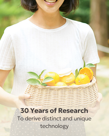 Woman holding basket of fruits