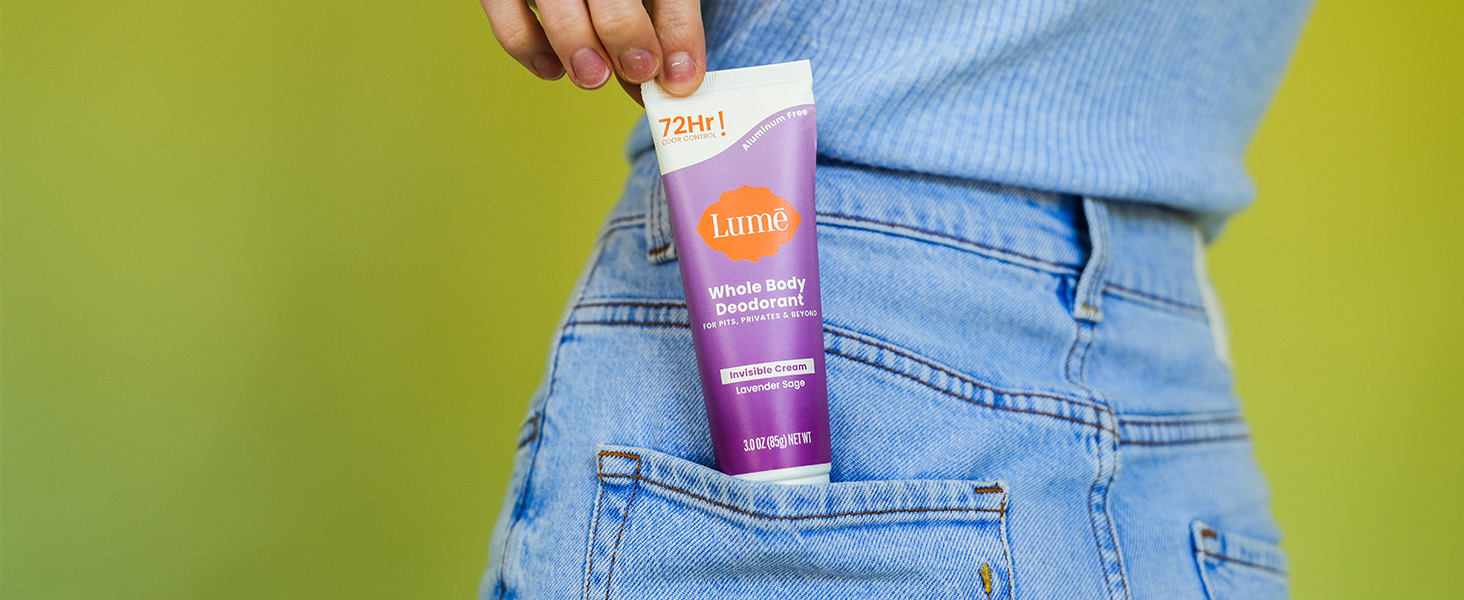 Lumē Cream Tube Deodorant in Lavender Sage being pulled out of pocket