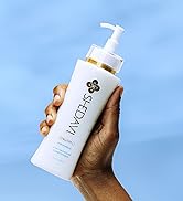 Left Hand Holding 5 in One Conditioner