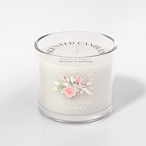 A clear glass candle holder with a delicate floral design etched or printed on the side. The holder has a wide, cylindrical shape.