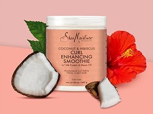 SheaMoisture smoothie container bottle with pieces of coconut and hibiscus on white background.