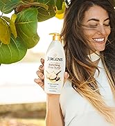 Woman holding a bottle of Jergens Enriching Shea Butter