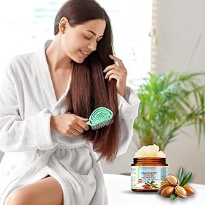 A woman caring for her hair with Organic Argan Oil Butter.