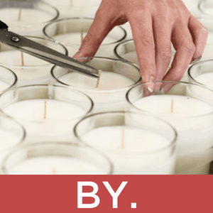 Trimming candle wicks