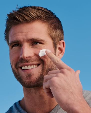 Model putting sunscreen on skin