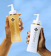 Two Hands holding Moisture Shampoo and Conditioner