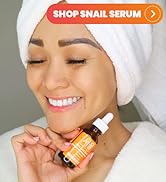 Korean skincare model holding a bottle of Seoul Ceuticals Snail Mucin Serum
