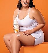 Woman holding a bottle of Jergens Ultra Healing Lotion