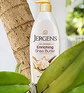 Bottle of Jergens Enriching Shea Butter by a tree