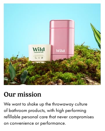 Two Wild brand personal care products: a pink cylindrical container and a smaller square container, displayed on moss with green leaves.