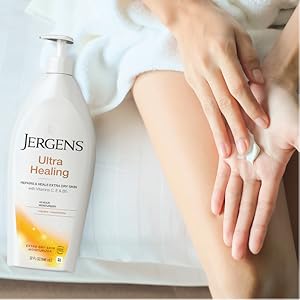 Woman rubbing lotion on her hand