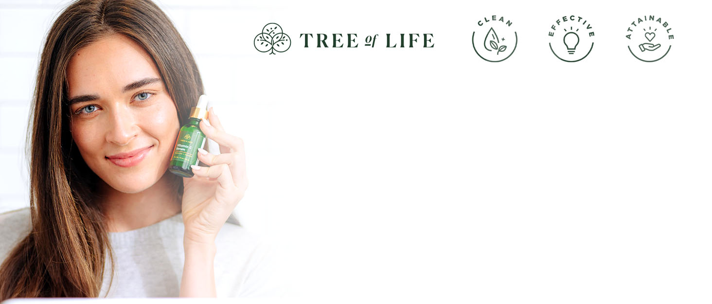 Tree of Life skincare products in a lush, greenery background