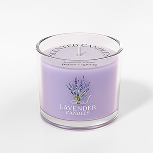 Purple-colored scented candle in clear glass container with lavender label and design, featuring a simple cylindrical shape.