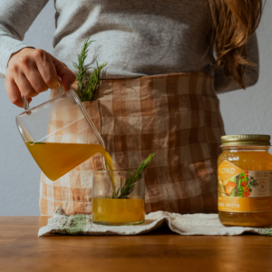 Pouring FOND bone broth into mug