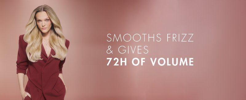 Woman with a healthy-looking, wavy blond hair. Next to text about smoothness and 72h of volume.