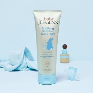 Bottle of Baby Jergens sensitive skin cream next to rubber ducky.