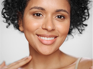 Woman smiling with hydrated skin