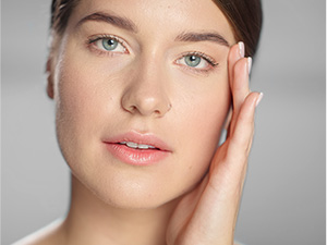 Woman smiling with hydrated skin