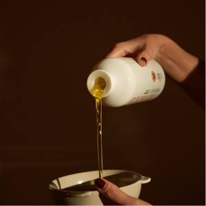 Olive oil being poured into a bowl
