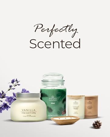 Selection of luxury soy wax candles presented on plain background.