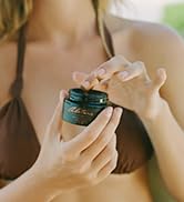 woman holding alitura meteorite facial scrub anti aging exfoliation organic pure