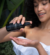 woman holding alitura moisturizer anti aging organic pure ingredients