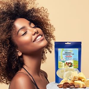 The woman nourishes her hair with Organic Cocoa Butter.