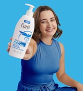 Woman holding a bottle of Curel Daily Healing Body Lotion